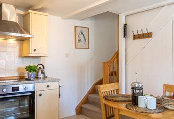 Stairs lead from the kitchen up to the bedrooms.