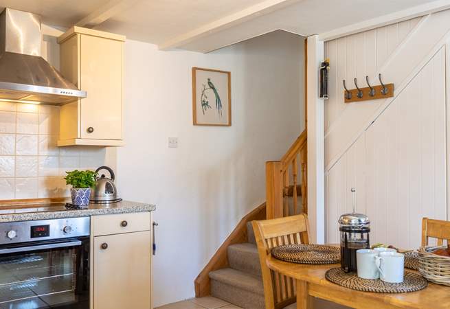 Stairs lead from the kitchen up to the bedrooms.