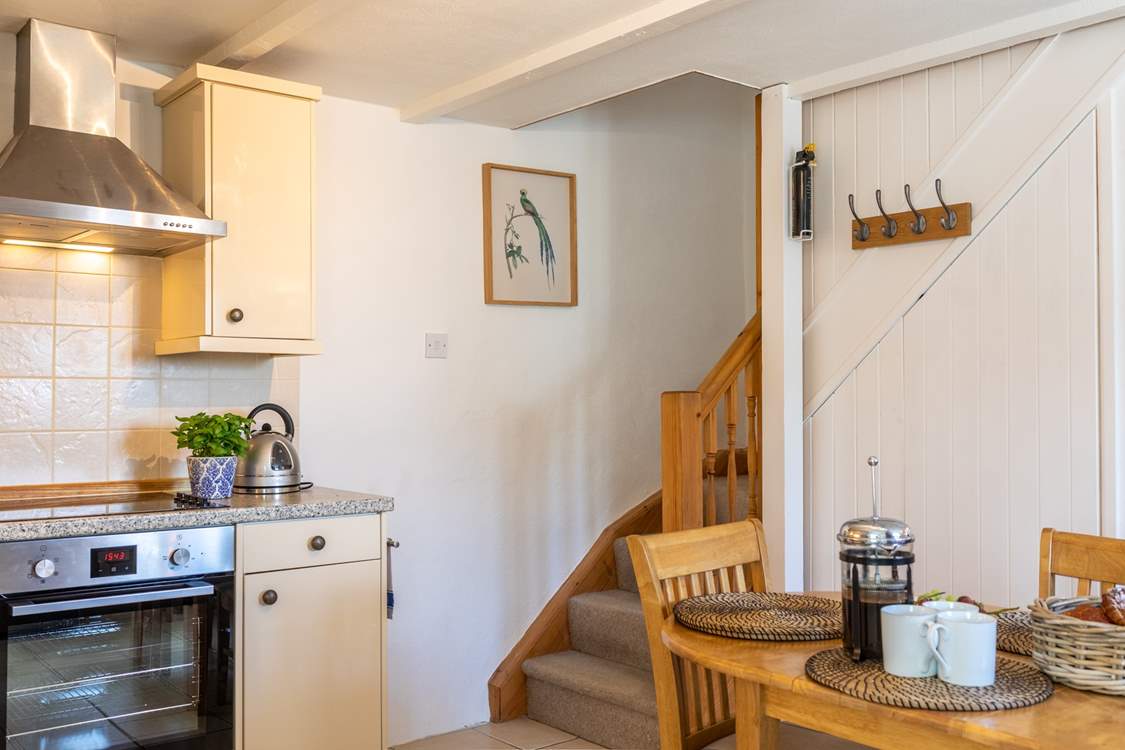 Stairs lead from the kitchen up to the bedrooms.
