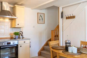Stairs lead from the kitchen up to the bedrooms.