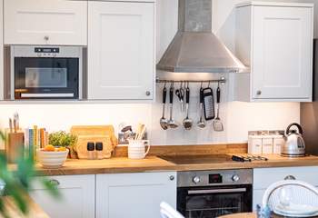 You will enjoy cooking in this well-equipped kitchen.