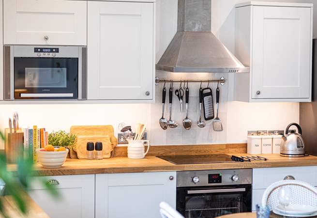 You will enjoy cooking in this well-equipped kitchen.