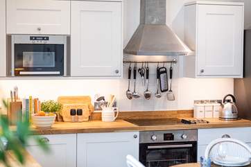 You will enjoy cooking in this well-equipped kitchen.