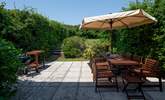 Step out of the house onto this fabulous patio and large garden which stretches out beyond. - Thumbnail Image