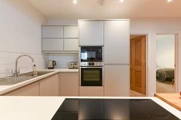 The kitchen has lots of cooking space and is very well-equipped.