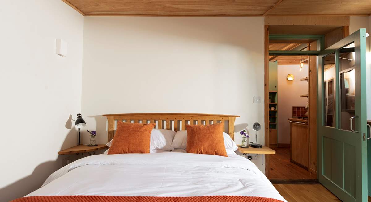 The bedroom is complete with a king-size double bed. 