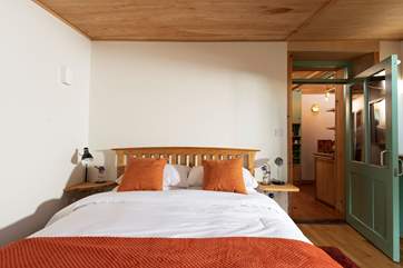 The bedroom is complete with a king-size double bed.