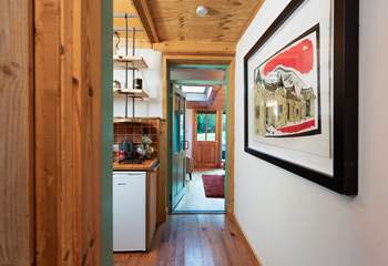 The bedroom leads through to the kitchen and on to the open plan living room. 