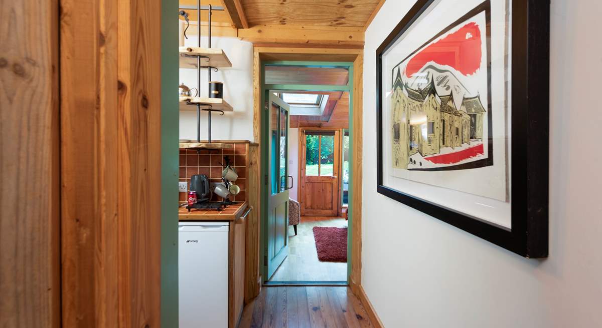 The bedroom leads through to the kitchen and on to the open plan living room. 