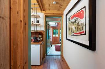 The bedroom leads through to the kitchen and on to the open plan living room.