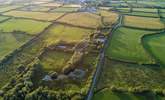 An ariel view of the lake and woods with the village of Woolsery in the distance. Straw Cottage is to the left of the white house in the centre of the photograph (the owners' home) and has its own large garden. - Thumbnail Image