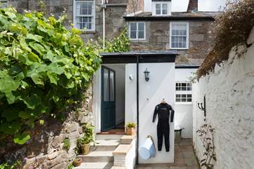 There is a handy outside tap and pegs for your wetsuits.