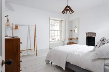 The master bedroom has channelled the Danish concept of hygge, a comforting and relaxing place to be.
