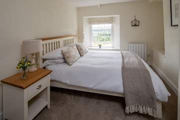 Bedroom 2 is light and airy, also with fabulous views out over the rolling countryside.