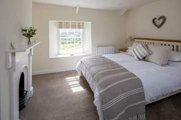 Bedroom 1 is super pretty with fabulous countryside views.