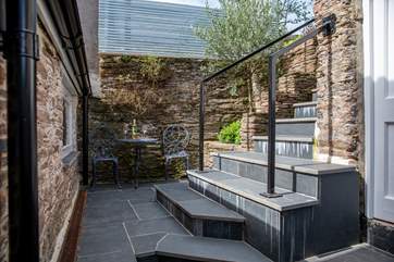 If you don't fancy taking the steps to the top patio, this cute bistro table for two is right on your doorstep.