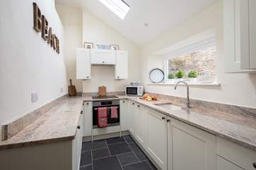 The kitchen is light, airy and fully equipped with everything you will need to whip up a family feast.