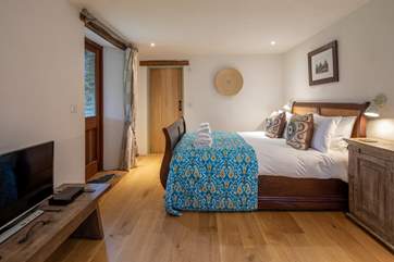 Master bedroom is home to this magnificent king-size bed.