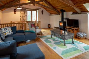 Cosy and inviting living area, with fabulous wood-burning stove.