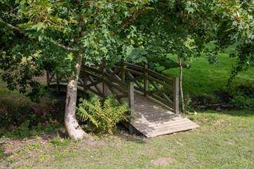 This beautiful bridge connects the grounds. Oodles of space and countryside for you to enjoy.