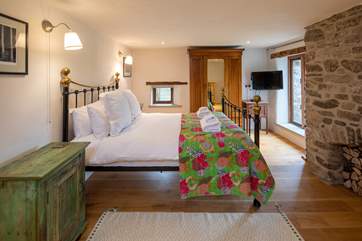 Master bedroom is vibrant and airy.