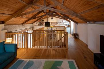 The stairs from the ground floor neatly connect the barn.