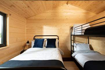 The second bedroom is equally as delightful and has both a double bed and bunk-beds (please note, the bed set-up is for flexibility - the cabin sleeps a maximum of 5 plus a baby only).