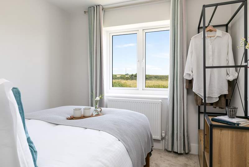 Bedroom 3 overlooks the fields, and you may even spot the local donkey grazing away. 