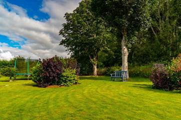Manicured lawns and gardens with numerous birds to enjoy spotting.