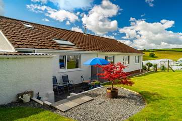 The Linhay is to the left-hand side of the bungalow but your patio area is fully screened and private.
