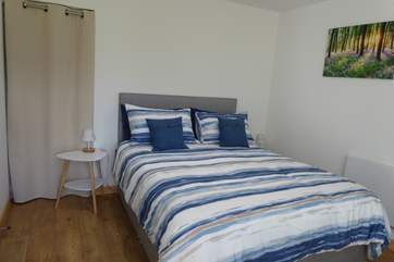 Enjoy a good night's sleep in this wonderful King size bed. Please note the door to the side of the bed links to the owners' bungalow but this will be locked, with a soundproof curtain fitted for privacy.