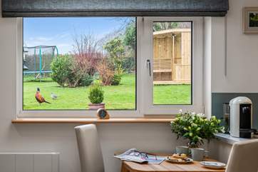 The view into the garden to the summer house from the dining table.