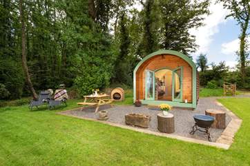 Tucked just under the edge of seven acres of woodland.
