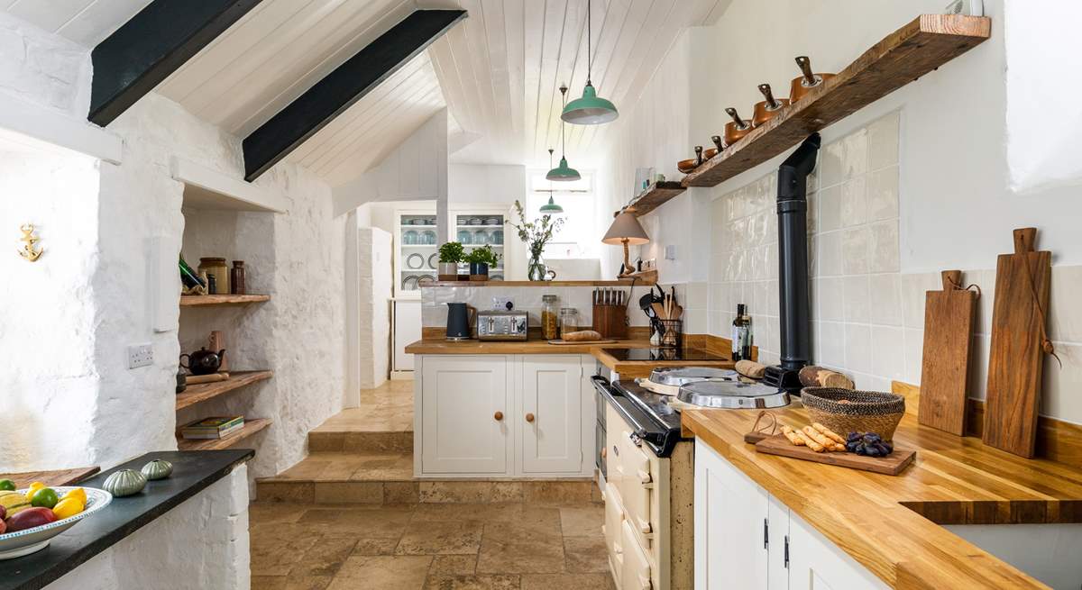 The fabulous kitchen awaits, please take care with the sloping ceilings and low door here. 