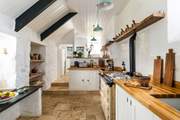 The fabulous kitchen awaits, please take care with the sloping ceilings and low door here.