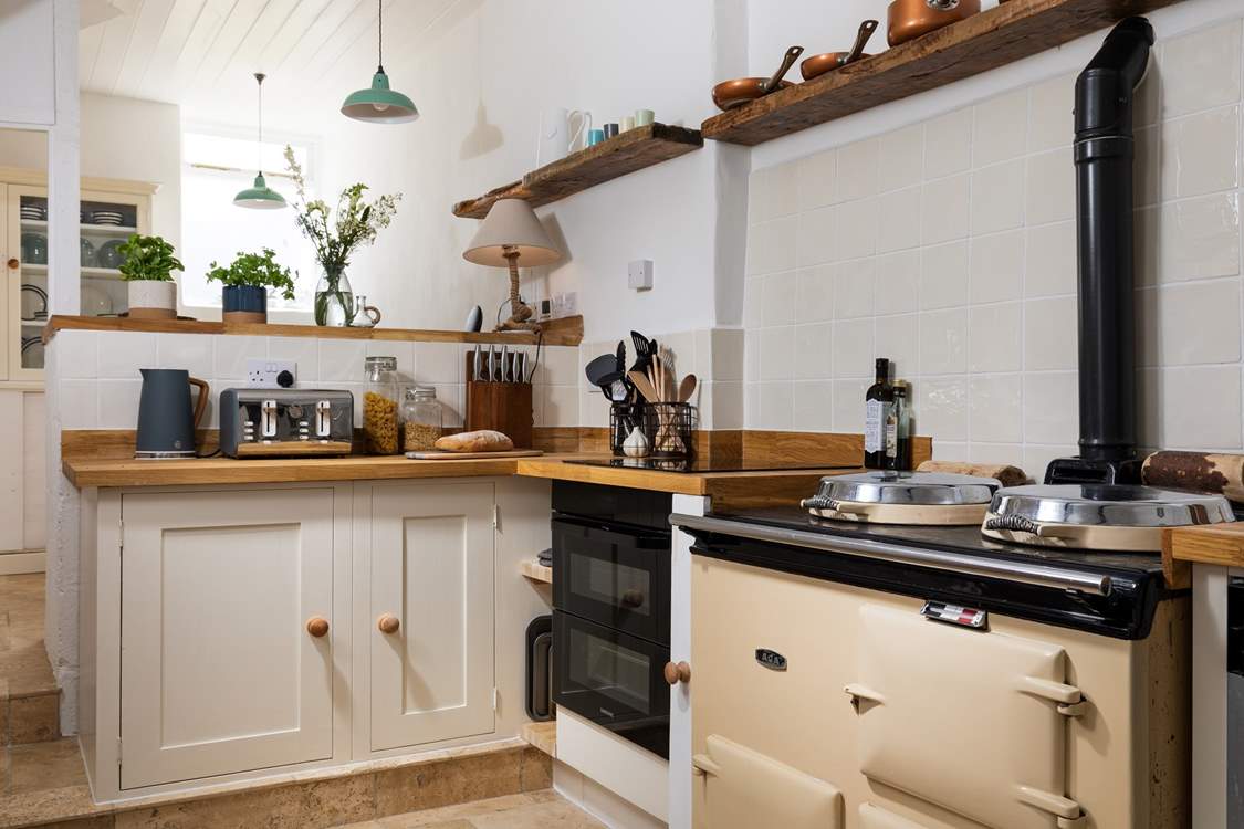 There is an electric oven and hob and an oil-fired Aga, which is on in the winter months.