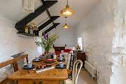 The dining-room, off the kitchen, opens to the courtyard and the conservatory - what a fabulous room.