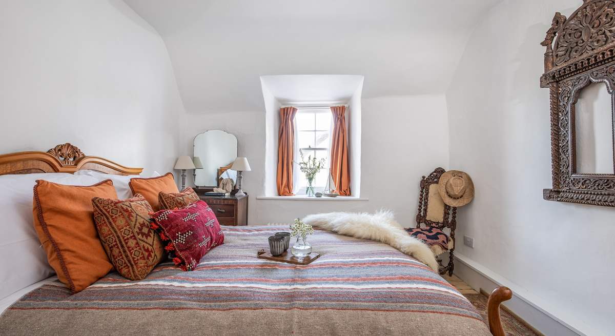 This bedroom (4) overlooks the quirky roof and courtyard garden. 