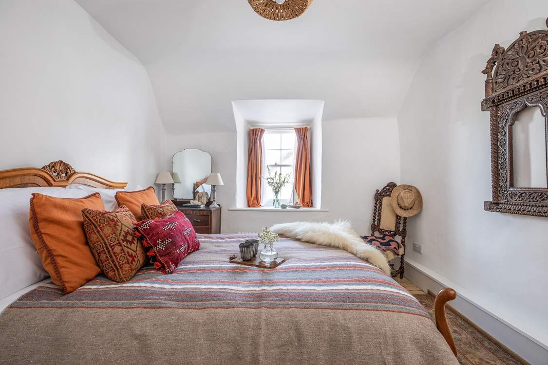 This bedroom (4) overlooks the quirky roof and courtyard garden.