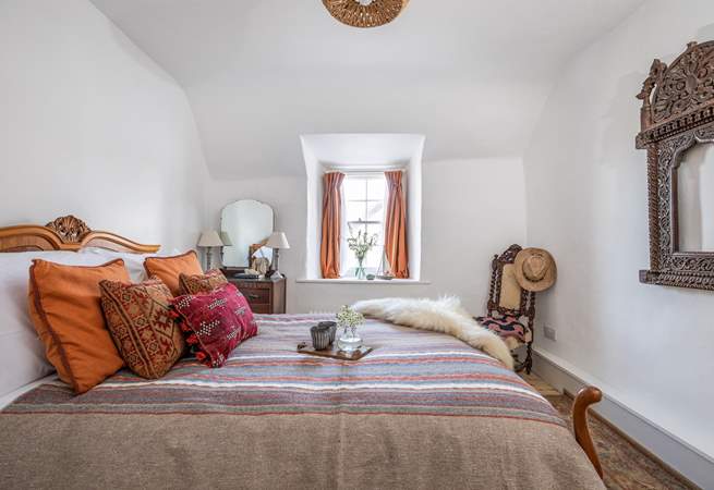This bedroom overlooks the quirky roof and courtyard garden. 