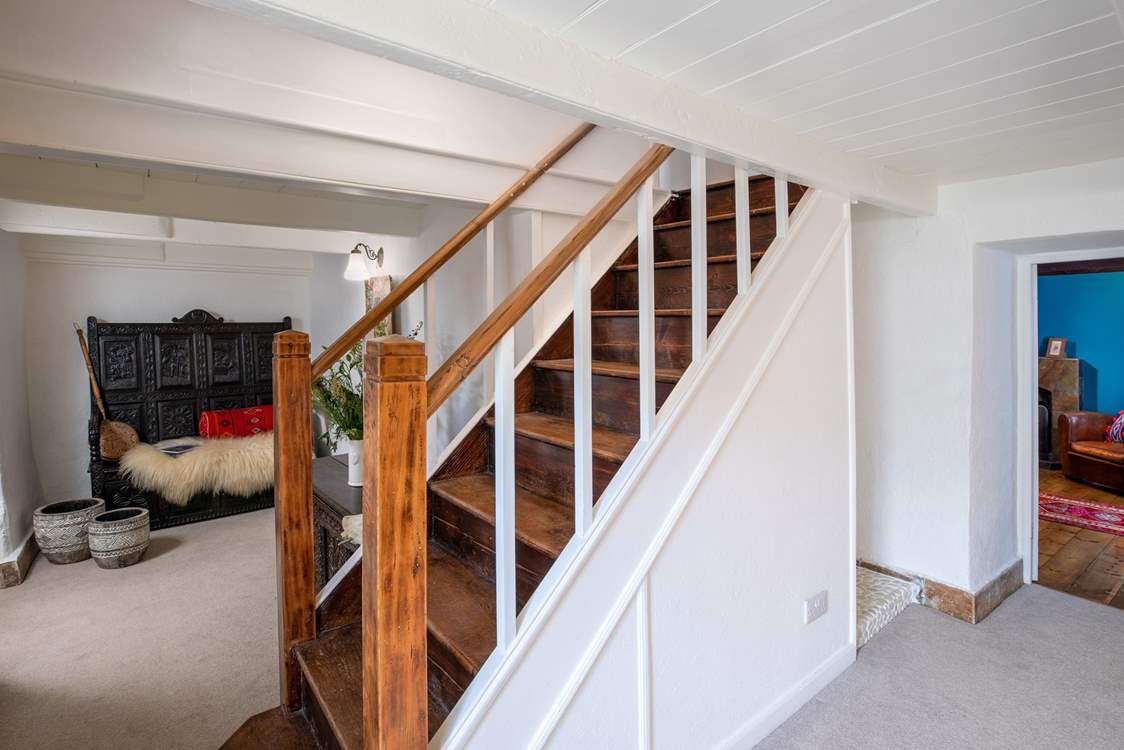 The stairs lead up to the three double bedrooms.