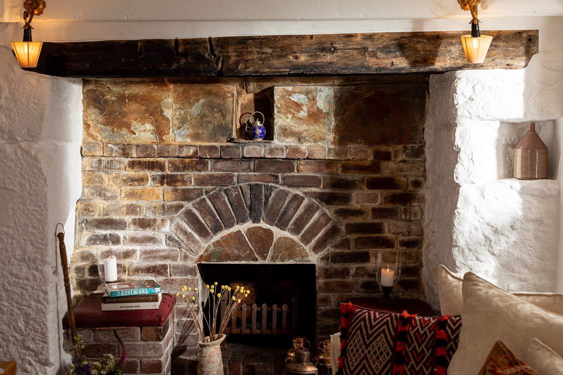Original features like this ornamental fireplace are just stunning and can be found throughout this lovely home.