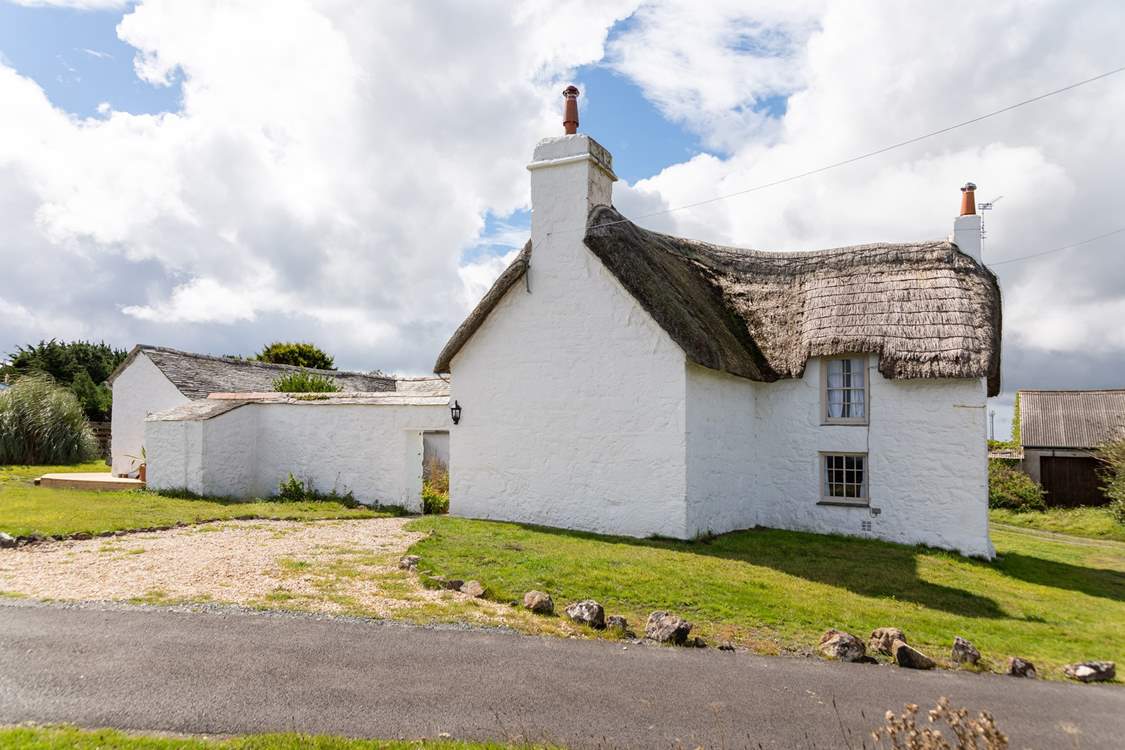 The coast path is a stone's throw from your front door along the lane (seen in this image), there is also a lane behind the cottage leading to a small one acre caravan park which is tucked away.