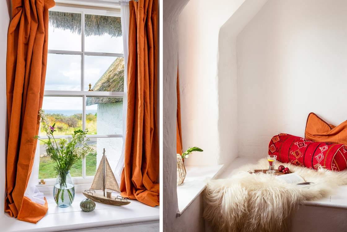 Sit in a cosy corner of the main bedroom, try not to get distracted by the sea view.