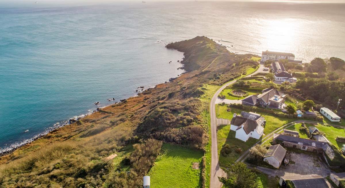 Chynhalls Farm House is the thatched property in the middle of the photo, what a location! 