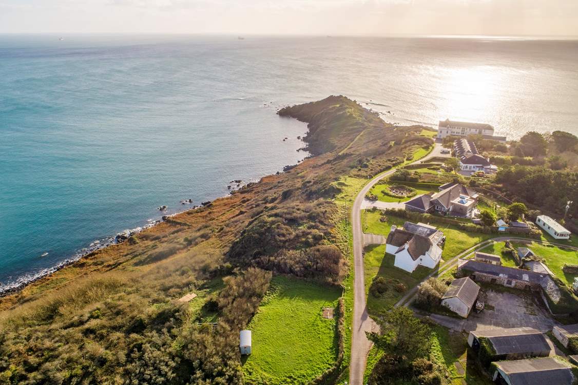 Chynhalls Farm House is the thatched property in the middle of the photo, what a location! 