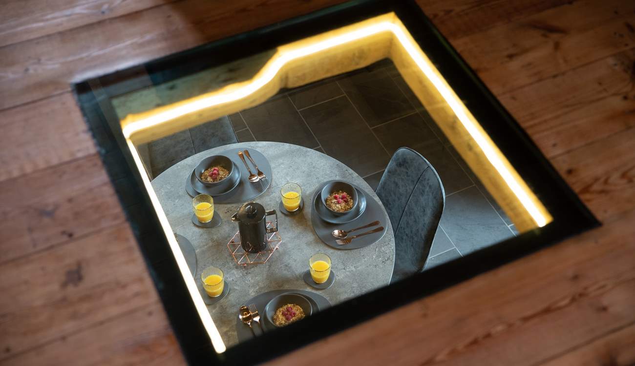 Need to keep an eye on the chef? No problem with this beautiful window looking down from the sitting-room in to the kitchen/diner.