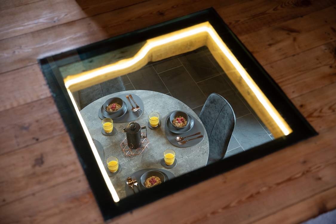 Need to keep an eye on the chef? No problem with this beautiful window looking down from the sitting-room in to the kitchen/diner.