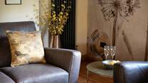 Switch off and relax in the super-stylish sitting-room that has views out over the countryside.