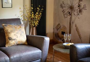 Switch off and relax in the super-stylish sitting-room that has views out over the countryside.